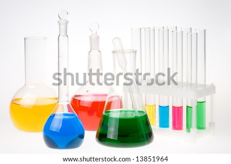 Various colorful glass laboratory ware on a white background