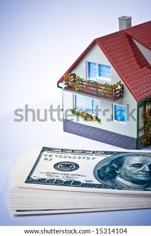 Miniature House and Money. Buying house concept