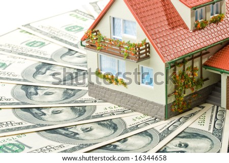 Miniature House and Money. Buying house concept
