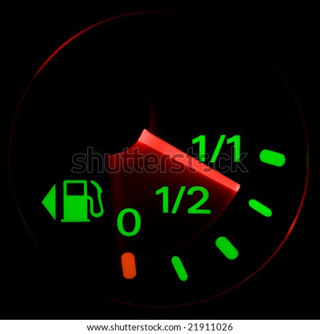 A gas gauge shows petrol level on a black background