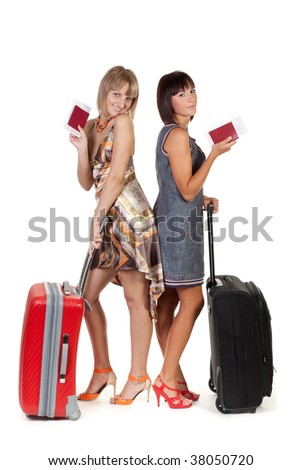 suitcases for girls. stock photo : Two nice girls with suitcases on a white background