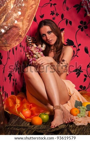 Young beautiful woman with fruit. East style.