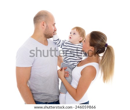Young parents with their  sweet  child play on a white background. Happy family.
