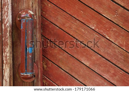 the old village on the wooden door handle