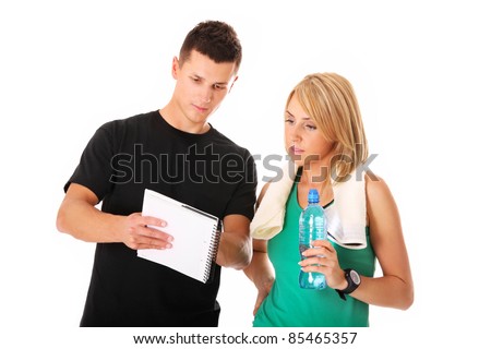 A picture of a young couple discussing workout plan over white background