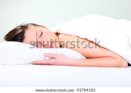 A picture of a pretty young woman sleeping over white background