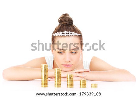 Young sad bride with gold coins over white background