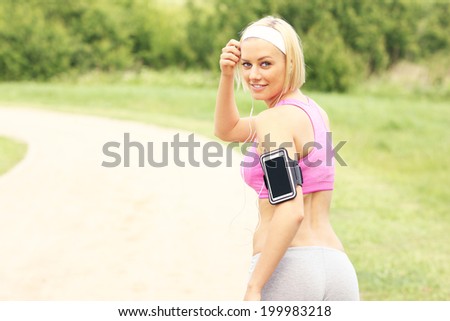 A picture of a happy athlete running in the park