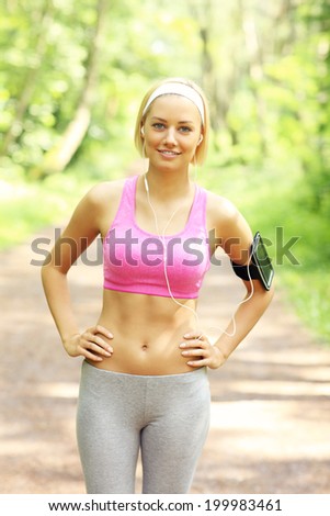 A picture of a happy woman running in the park