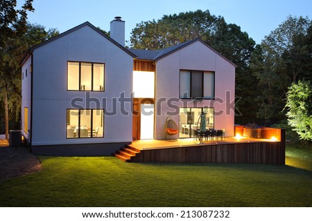 A picture of a modern luxury house and garden