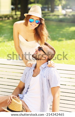 A picture of a young couple meeting in the park
