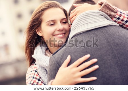A picture of a beautiful woman comforting a man