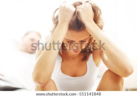 Picture showing young woman and her man having problem in bedroom