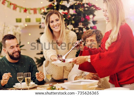 Group of family and friends celebrating Christmas dinner