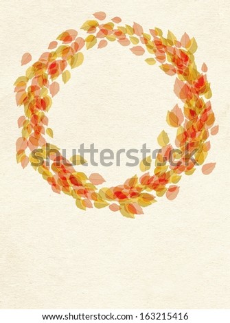 Decorative frame of leaves arranged in a circle, wreath on textured paper background