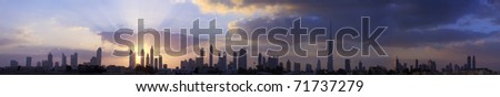 High resolution panoramic view of dubai buildings including burj khalifa with beautiful clouds and sunrise background.
