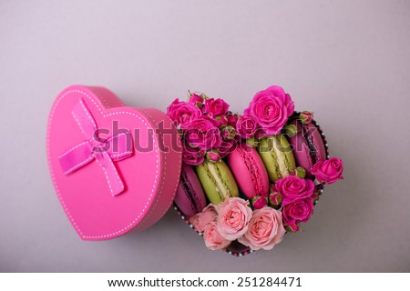 present box heart shape with flowers and macaroons background for valentines mother day easter with love