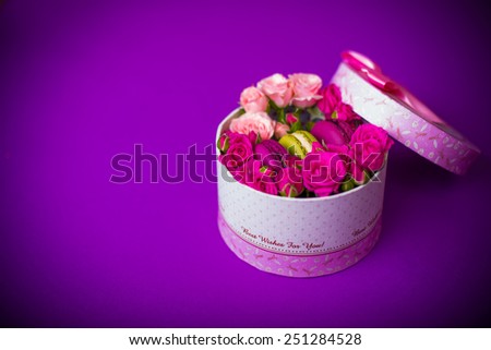 present box with flowers and macaroons violet background for valentines mother day easter with love