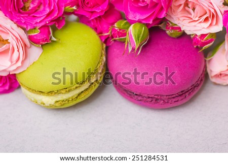 spring berry color macaroons with roses background for valentines mother woman day easter with love