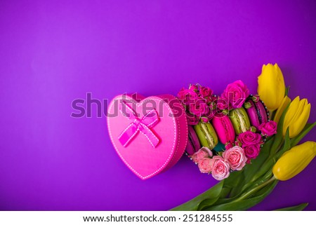 present box with flowers macaroons and tulips violet background for valentines mother day easter with love