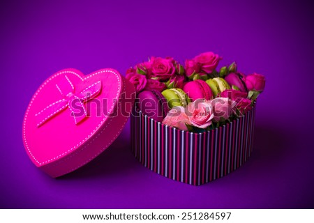 present box heart shape with flowers and macaroons violet background for valentines mother woman day easter with love