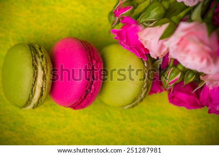 berry spring color macaroons with roses yellow background for valentines mother woman day easter with love