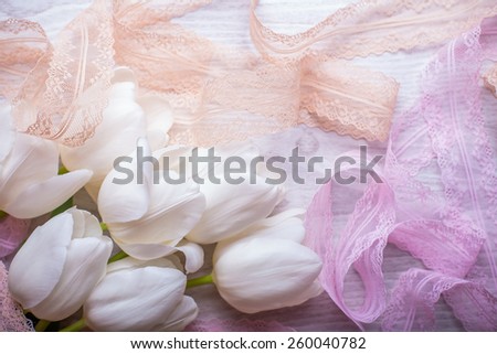 spring flowers white tulips bouquet on wooden background with lace ribbon present for holidays mother day easter valentines wedding
