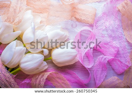 spring flowers white tulips bouquet on wooden background with lace ribbon present for holidays mother day easter valentines