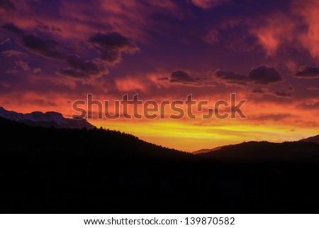 In spring, the sun rises at the distant point of the Inn Valley of Tyrol, Austria.  With the right cloud cover, this creates incredibly majestic sunrises in the mountains of the Austrian Alps.