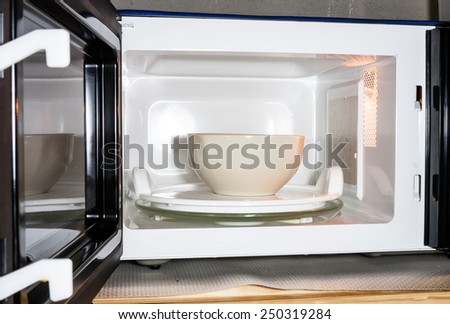 Image of ceramic bowl in microwave oven for food preparation