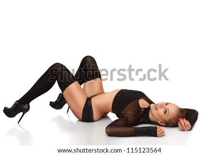 Sexy young blonde woman lying down on back isolated on white background