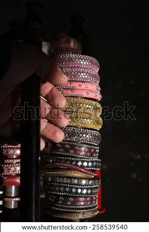 Colorful bangles with glass work, made up of waste material, saving the environment
