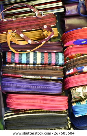 lot of colorful hand purses, a whole background