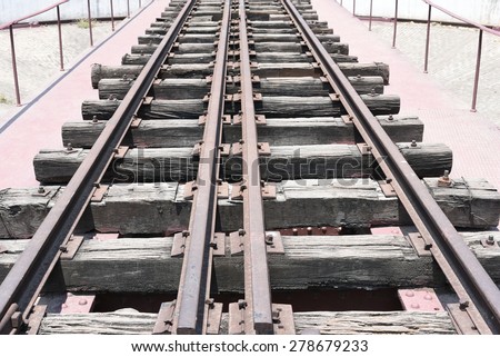 Rail Tracks on wooden planks, old technology of rail tracks
