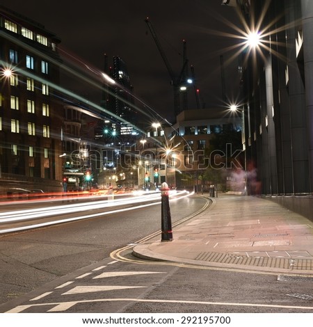Light trails of Buses and Cars on a Urban City road at night, artistic long exposure shot