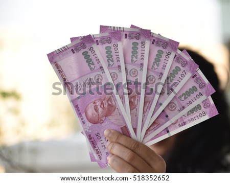 Two thousand indian rupee in background, New currency introduced to curb Black Money
