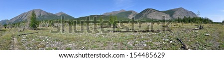 Russia, Yakutia, Oymyakon highlands, a ridge of Suntar-khayata. Panorama of a mountain ridge near the river Suntar.