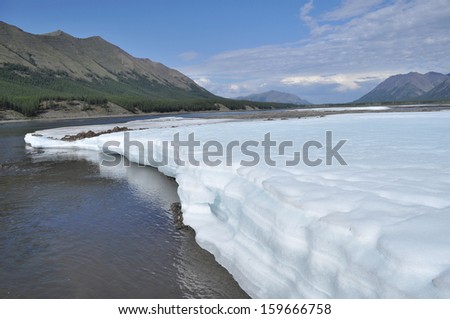 Russia, Yakutia, a ridge of Suntar-khayata, river Suntar, August. The permanent ice fields in the tideway of the Yakut river.