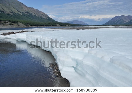 Russia, Yakutia, a ridge of Suntar-khayata, river Suntar, August. The permanent ice fields in the tideway of the Yakut river.