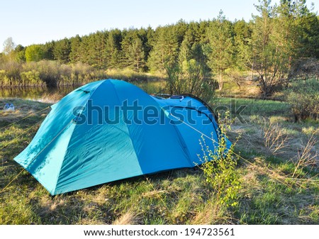 Tourist tent, put on spring grass in the national Park \