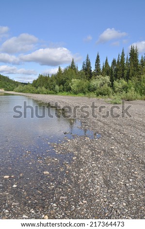Pebbly shore North of the Ural river. River Kokila flows on the Western slope of the Polar Urals.