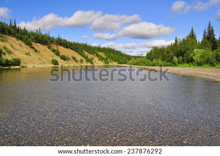 Pebbly shore North of the Ural river. River Kokpela flows on the Western slope of the Polar Urals.