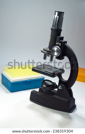 The microscope on a white background. Scientific equipment - optical device in a biological laboratory.