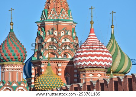 Domes of St. Basil\'s Cathedral on red square. The St. Basil\'s Cathedral in Moscow\'s red square, illuminated by the sun.