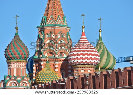 Domes of St. Basil's Cathedral on red square. The St. Basil's Cathedral in Moscow's red square, illuminated by the sun.