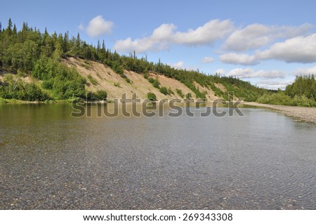 Pebbly shore North of the Ural river. River Kokila flows on the Western slope of the Polar Urals.