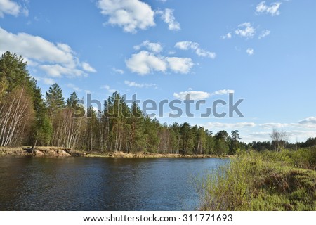 Sunny day at the spring river. Spring landscape, river in the national Park 