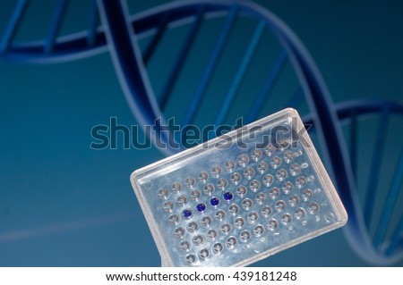 DNA testing in the laboratory. Well plate with samples on the background of the DNA sequence.