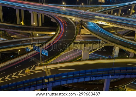 Modern city traffic road at night. Transport road junction.