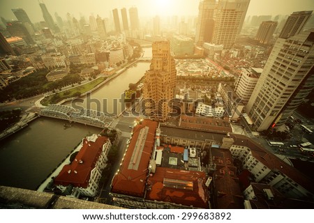 Panorama view of Shanghai city scape in fog at sunset time. Aerial view